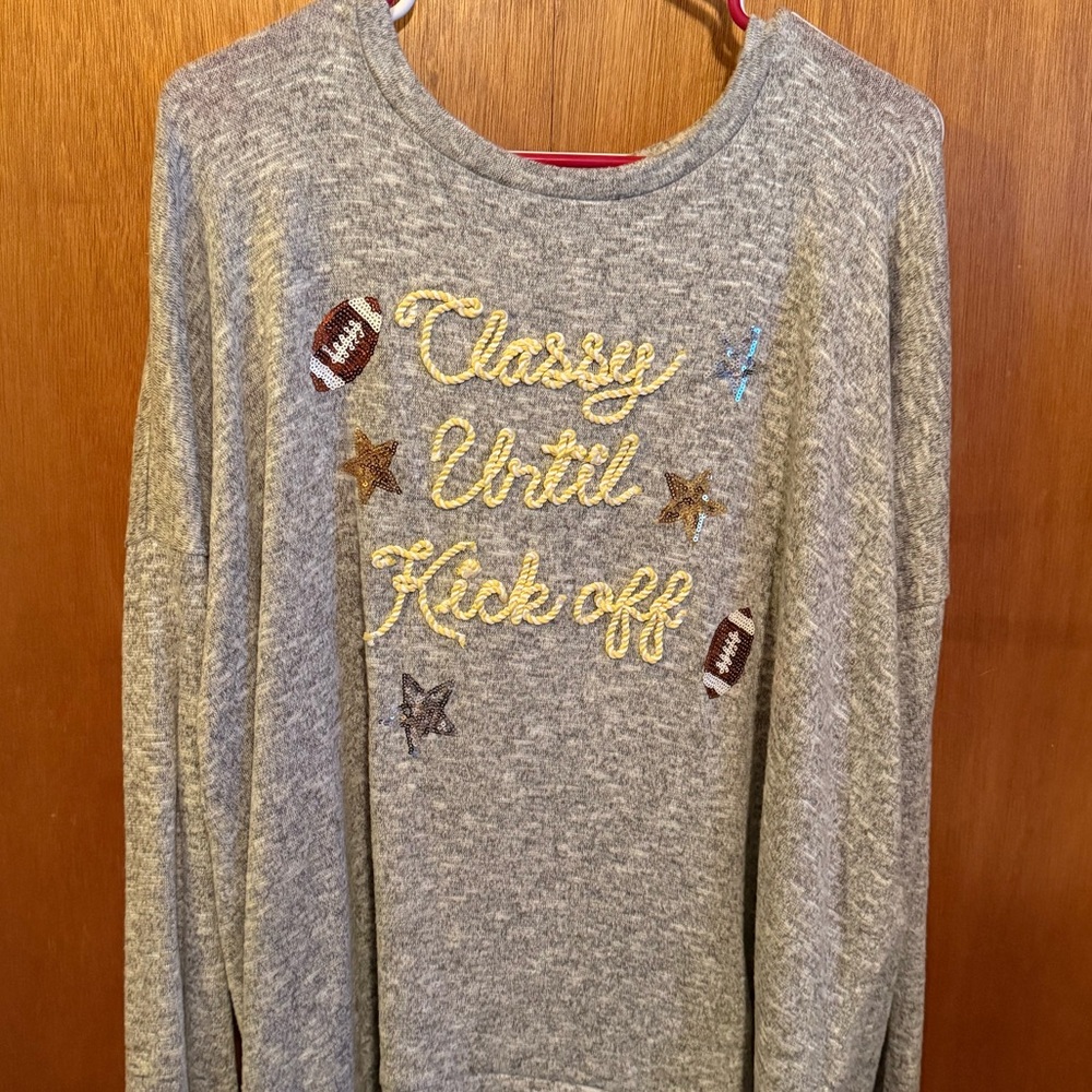 Super cute football sweater.